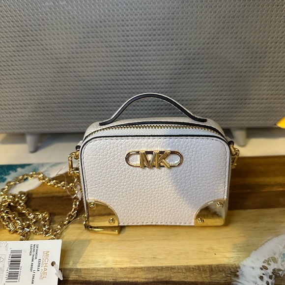Michael Kors Handbags - Michael Kors Mini Bag in White with Gold Accents